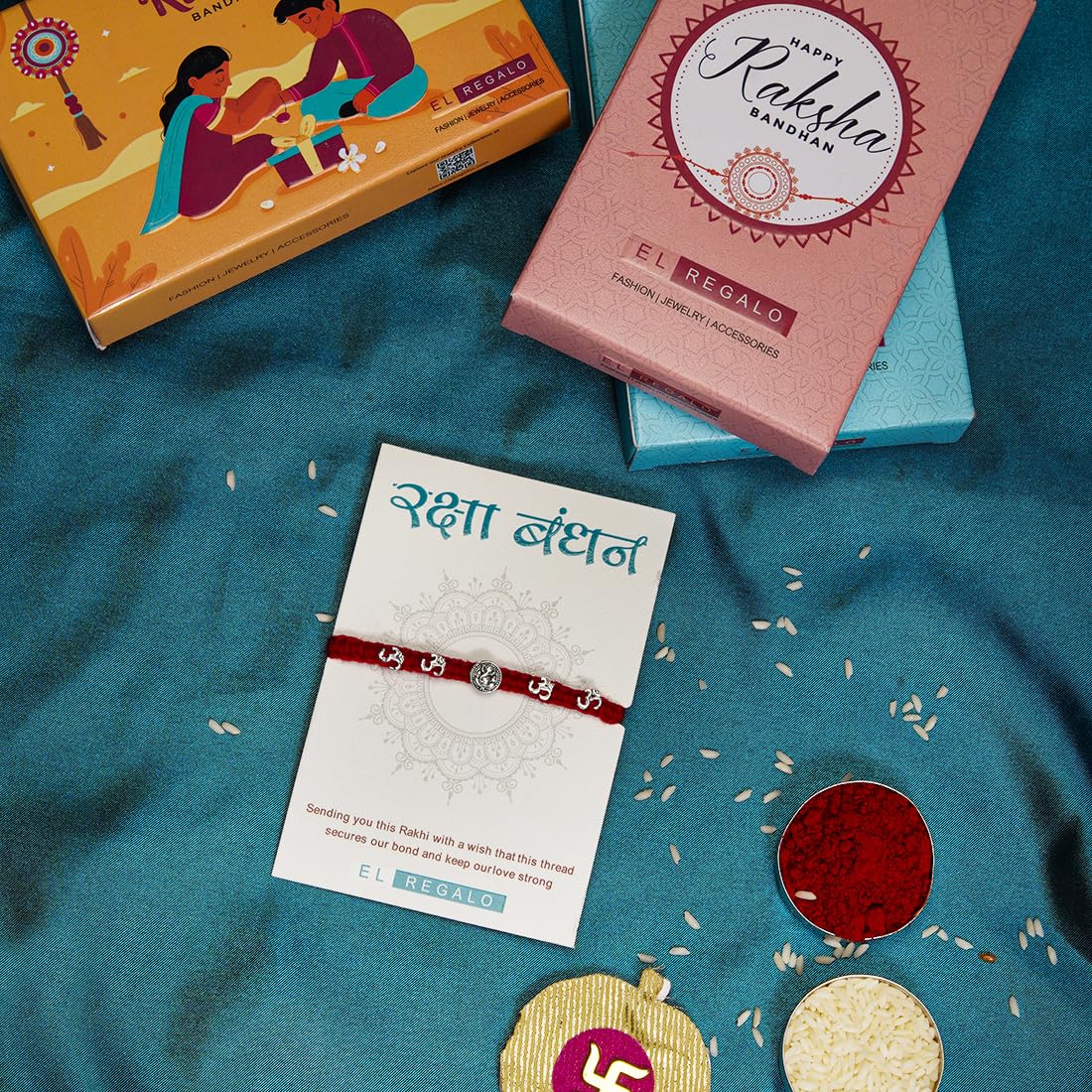 El Regalo Boy's Om Ganesha Swastik Red Moli Thread Rakhi For Brother/Bhai/Bhaiya- Auspicious Om/Aum, Ganesha, Satiya Mauli Rakhi With Roli Chawal Shagun, Message Card In Rakhi Gift Box