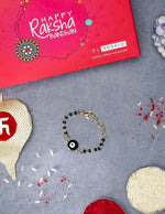 El Regalo Cute Evil Eye Nazaria Bracelet Rakhi for Babies/Kids with Roli Chawal, Rakhi Message card in Rakhi Gift Box- Baby Nazaria Rakhi (Black Evil Eye Nazaria Rakhi)