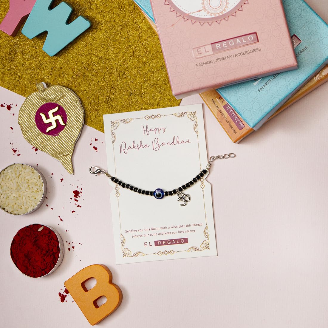 El Regalo 1st Rakhi for Baby Brother - 925Silver Plated Cute Charms Evil Eye Nazaria Rakhi with shagun, Rakhi Message Card in Rakhi Gift Box for Kids/Babies/Toddlers (OM Evil Eye Nazaria Rakhi)