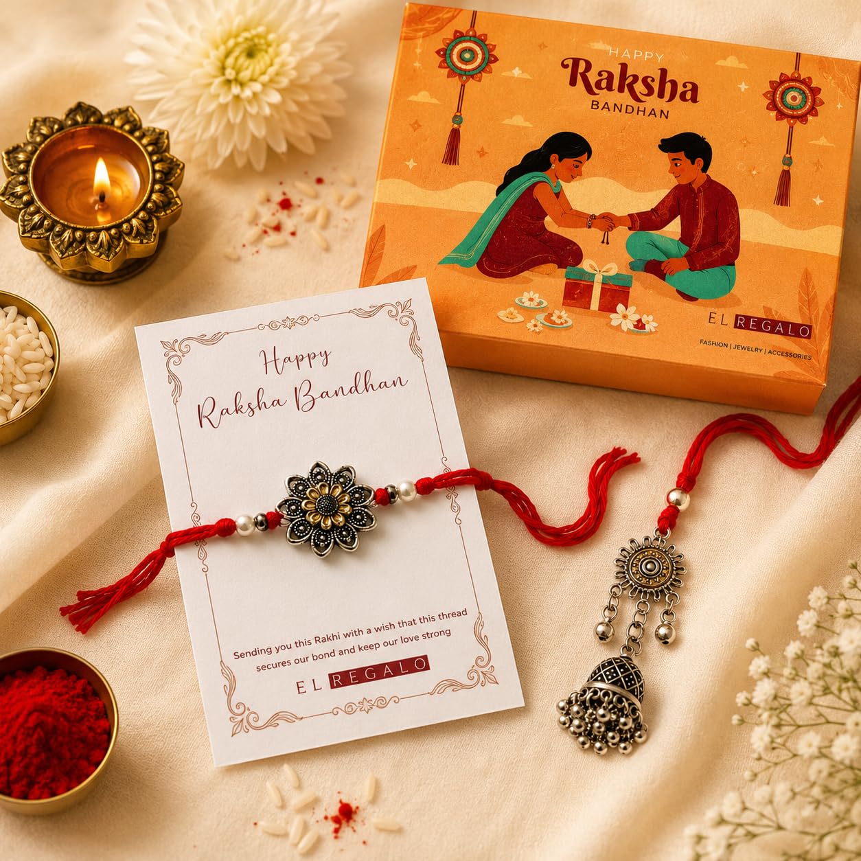 El Regalo Red Lumba Rakhi Set For Bhaiya Bhabhi - German Silver Rakhi Combo Set with Roli Chawal, Message Card in Rakhi Gift Box