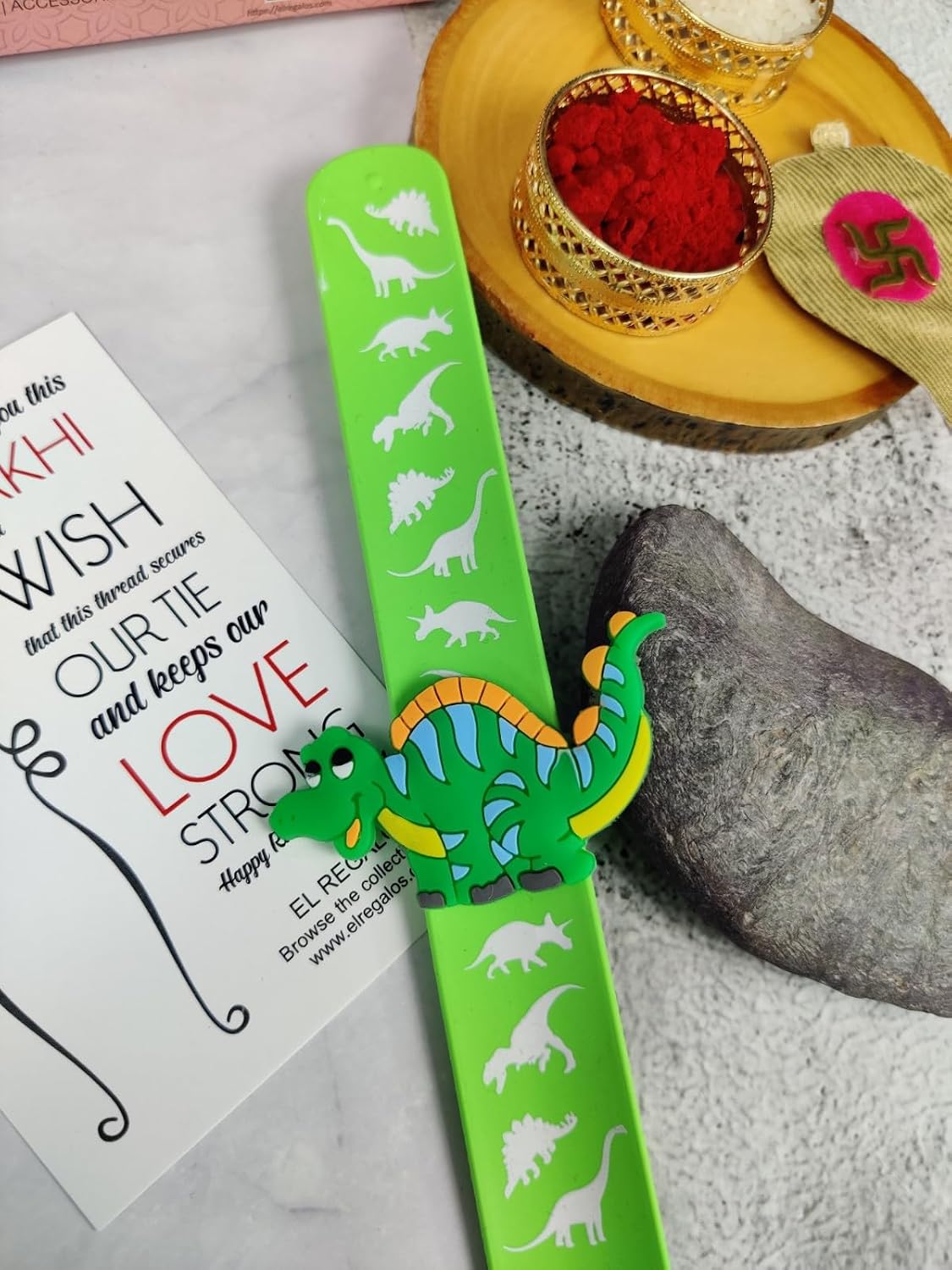 El Regalo 1PC Cute Kids Slap Band Rakhi for Little Brother or Sister- Colorful Dinosaur Fun Kids Rakhi with Roli Chawal in Rakhi Gift Box for Brother/Niece or Nephew (Green Dinosaur Slap Band Rakhi)