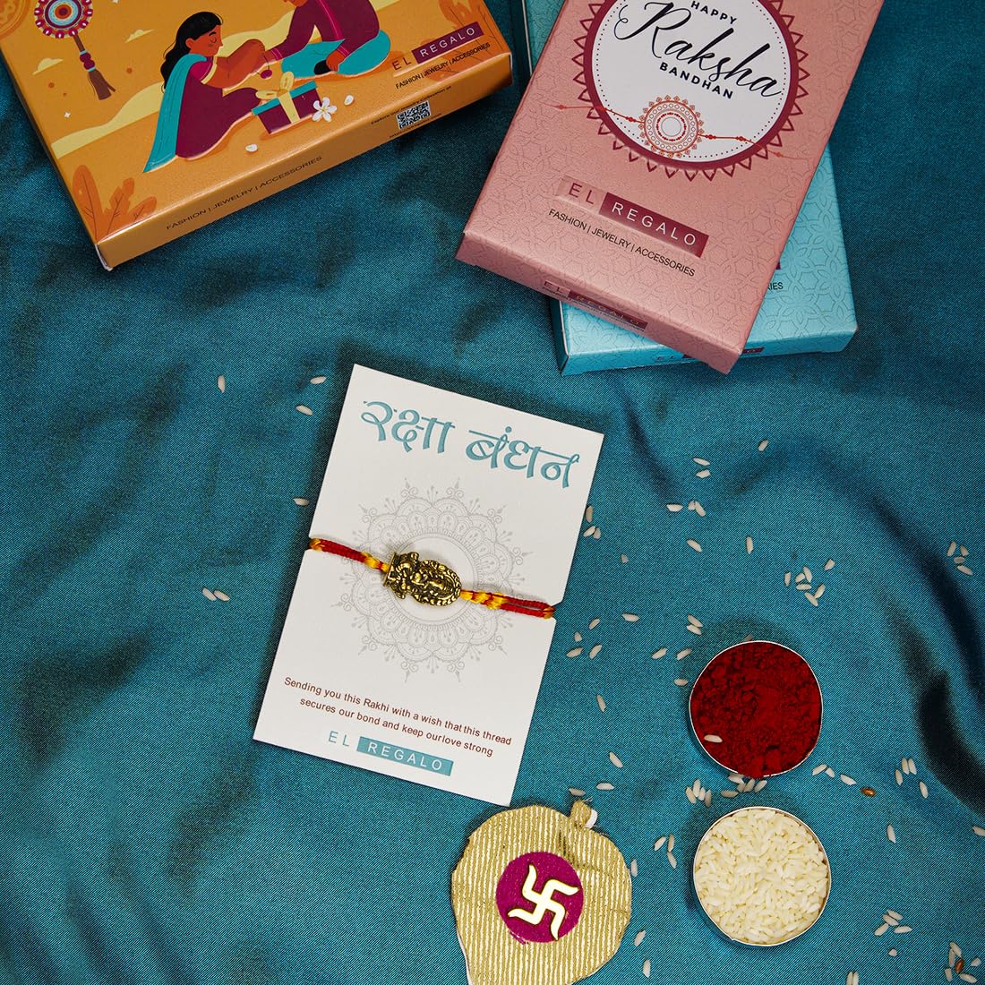 El Regalo OM Ganesha Red Thread Rakhi for Brother/Bhai/Bhaiya- Auspicious OM/Aum, Ganesha Rakhi with Roli Chawal Shagun, Rakhi Message Card in Rakhi Gift Box (Ganesha Moli)