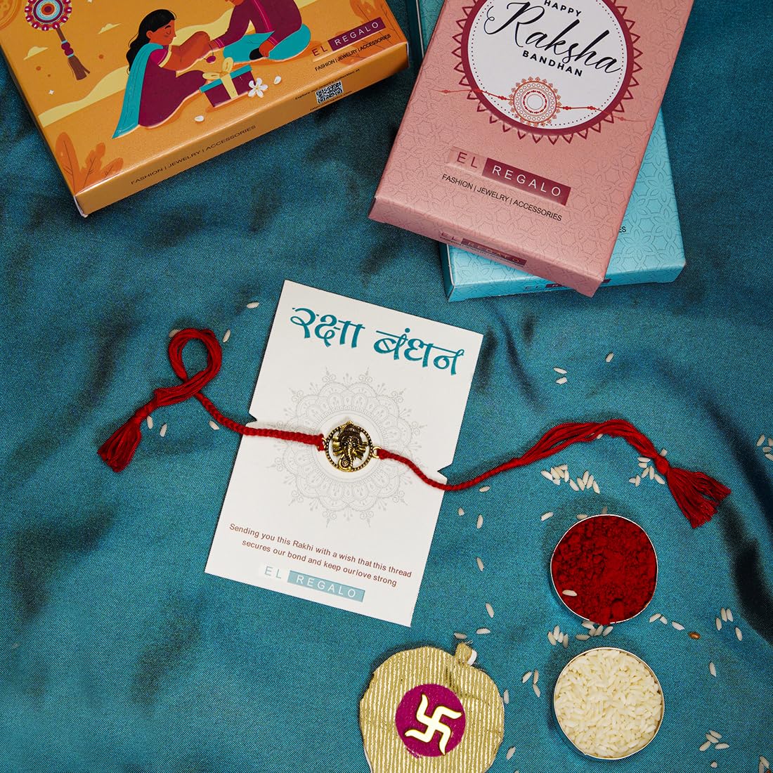 El Regalo OM Ganesha Red Thread Rakhi for Brother/Bhai/Bhaiya- Auspicious OM/Aum, Ganesha Rakhi with Roli Chawal Shagun, Rakhi Message Card in Rakhi Gift Box (Ganesha Gold)