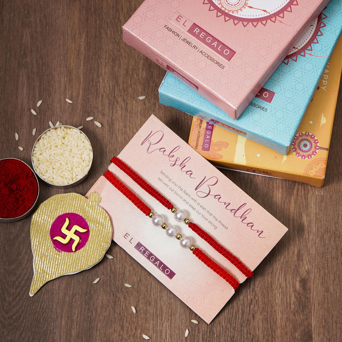 El Regalo 2PCs Pearls Rakhi Combo Set for Bhaiya-Bhabhi/Bhai- Bhatija/Bhatiji- Rakhi Gift Combo with 2 Pearls Rakhi, Roli-Chawal Shagun Pack, Message Card in Gift Box (Red)