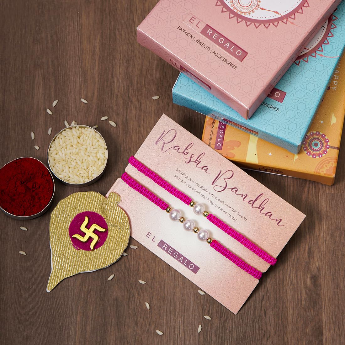 El Regalo 2PCs Pearls Rakhi Combo Set for Bhaiya-Bhabhi/Bhai- Bhatija/Bhatiji- Rakhi Gift Combo with 2 Pearls Rakhi, Roli-Chawal Shagun Pack, Message Card in Gift Box (Rose Pink)