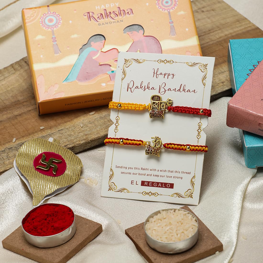 El Regalo 1PC Auspicious Thread Rakhi Brother- Red & Yellow Thread OM, Ganesha, Shree, Trident, Damroo Mauli Rakhi with Roli Chawal Shagun, Message Card in Rakhi Gift Box (Shiv Rakhi)