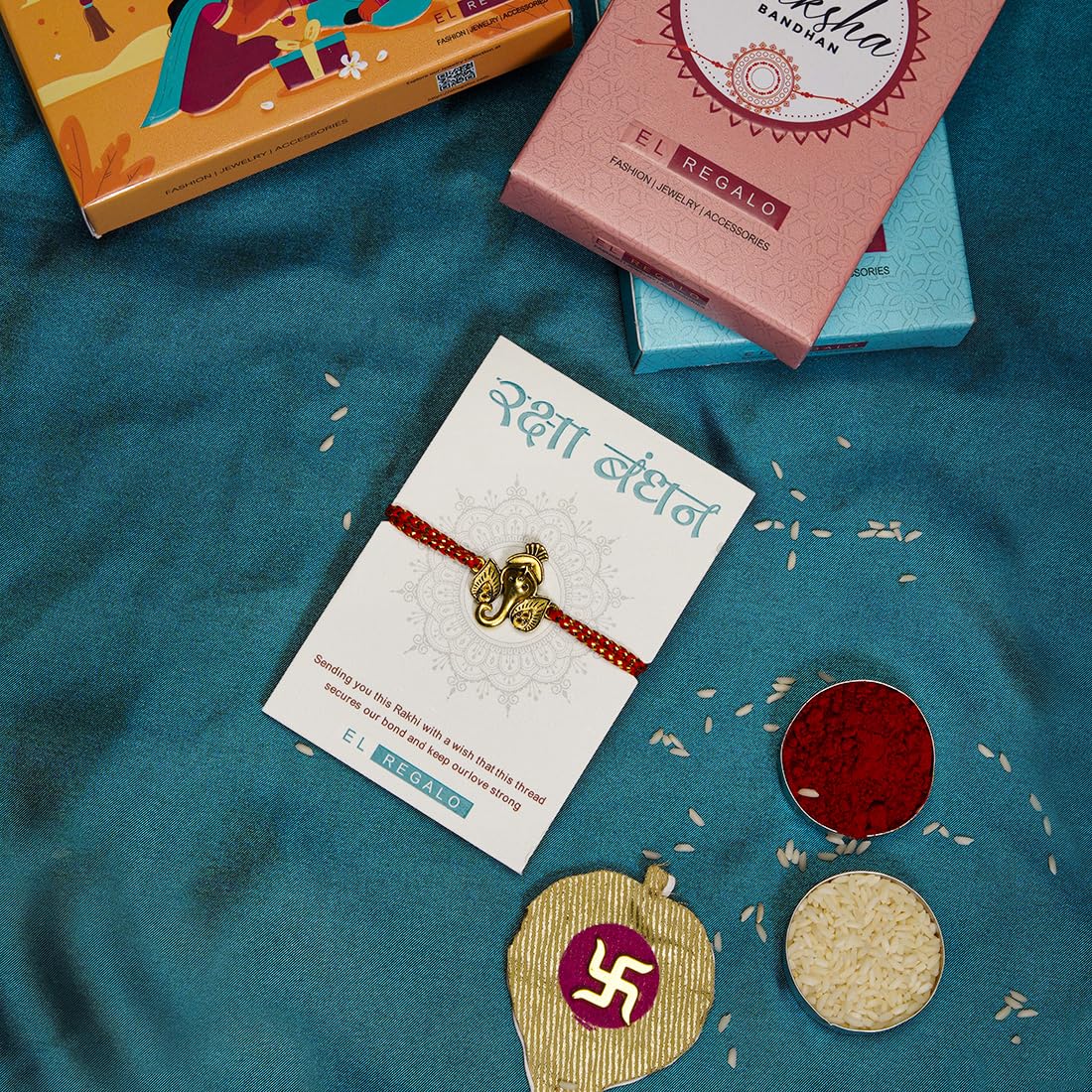 El Regalo OM Ganesha Red Thread Rakhi for Brother/Bhai/Bhaiya- Auspicious OM/Aum, Ganesha Rakhi with Roli Chawal Shagun, Rakhi Message Card in Rakhi Gift Box (Ganesha Red)