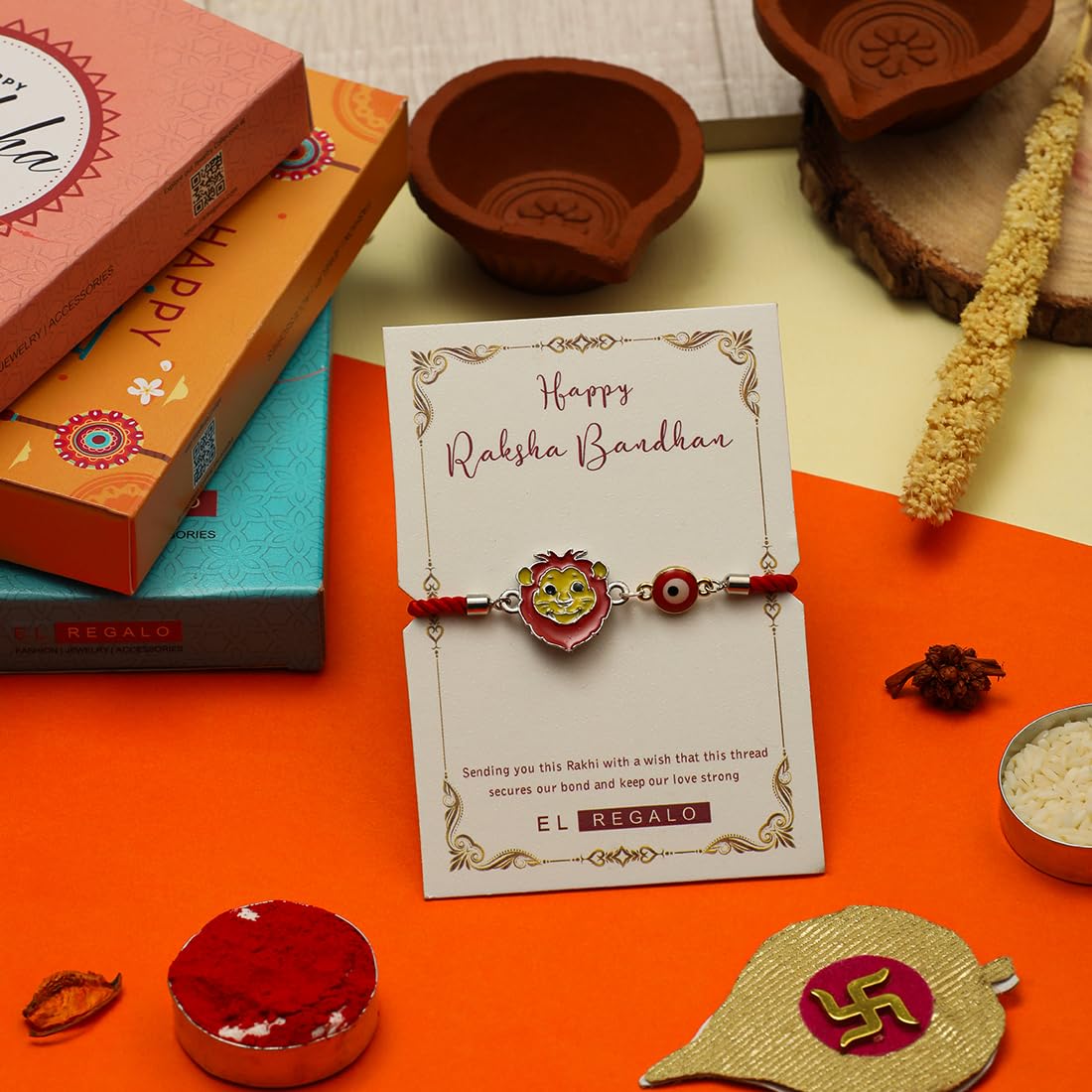 El Regalo Designer Evil Eye Lion Kids Rakhi for Brother- Cute Evil Eye Lion Rakhi with Roli Chawal Shagun, Rakhi Message Card in Rakhi Gift Box for Little Brother (Red)