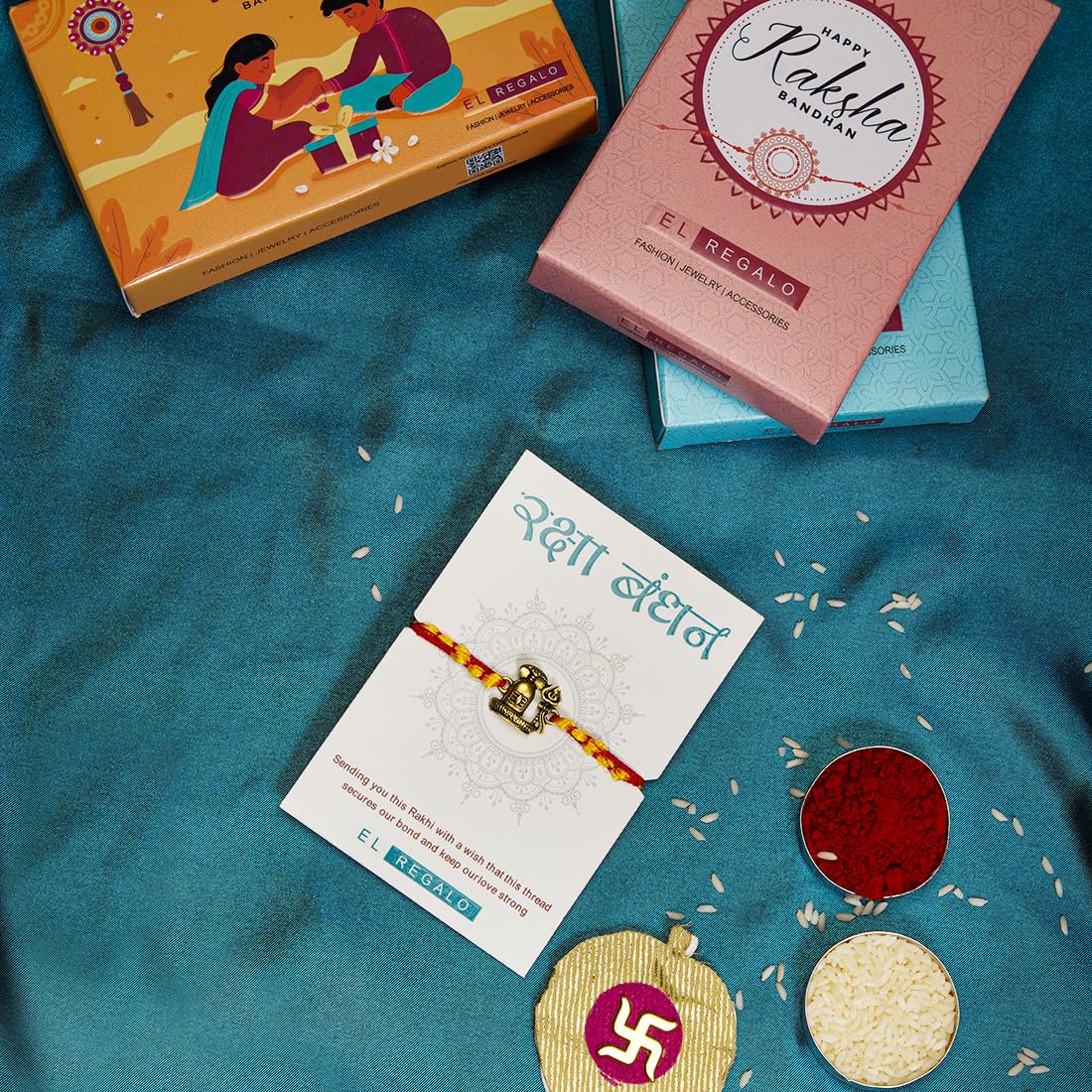 El Regalo OM Ganesha Red Thread Rakhi for Brother/Bhai/Bhaiya- Auspicious OM/Aum, Ganesha Rakhi with Roli Chawal Shagun, Rakhi Message Card in Rakhi Gift Box (Shiva Moli Rakhi)