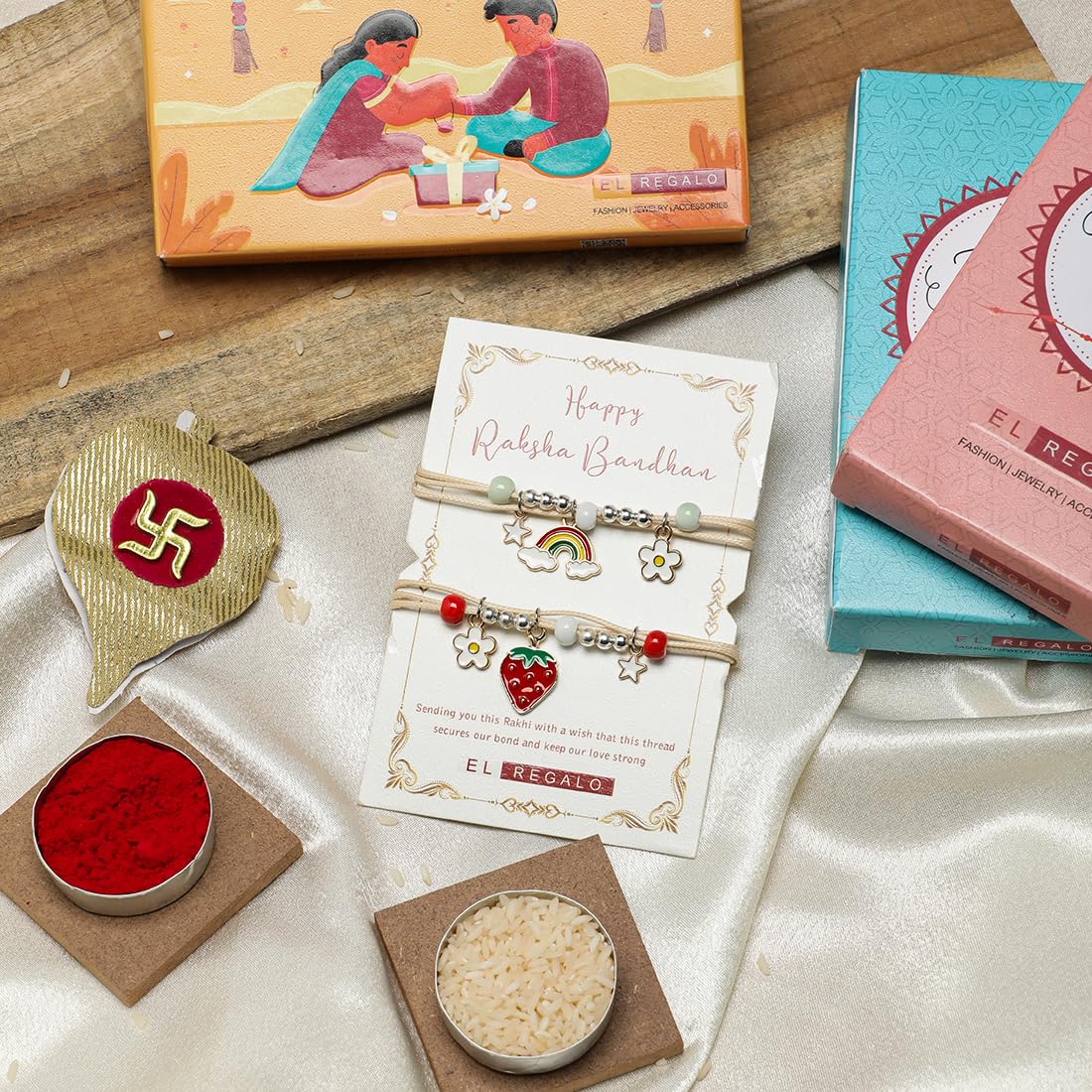 El Regalo 2 PCs Cute Kids Fancy Rakhis Combo Set - Beautiful 2 Kids Rakhis Set with Roli Chawal, Rakhi Message Card in Rakhi Gift Box for Little Brother/Niece/Nephew (Strawberry & Rainbow Rakhis)