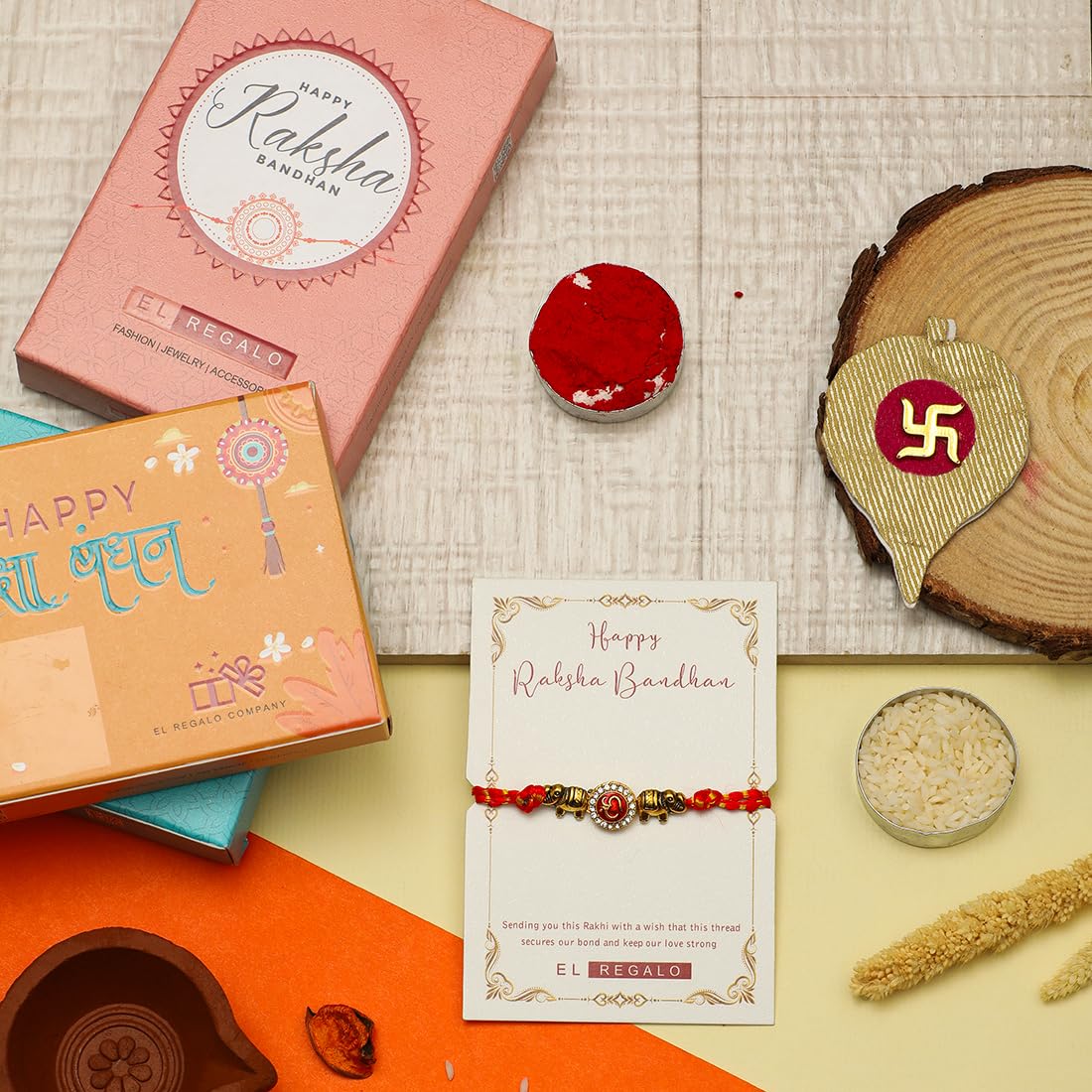 El Regalo 1PC Fancy OM Ganesha Swastik Red Moli Thread Rakhi for Brother/Bhai/Bhaiya- Auspicious OM/Aum, Ganesha, Satiya Rakhi with Roli Chawal, Rakhi Message Card in Rakhi Gift Box (OM Rakhi)