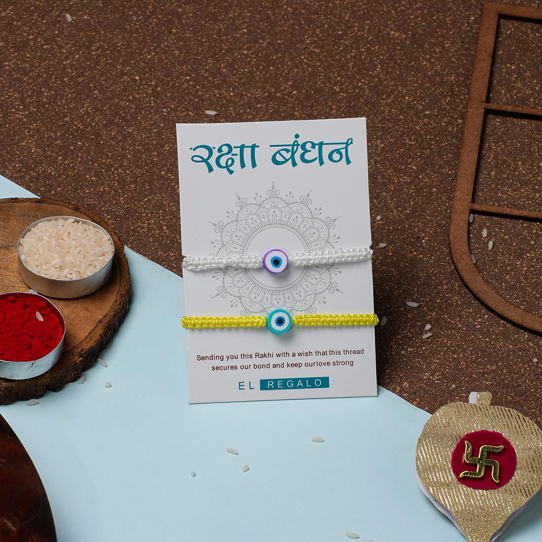 El Regalo 2PCs Rakhi Combo Set for Bhai-Bhabhi or Bhai-Bhatija/Bhatiji- 2 Evil Eye Rakhis Set with Roli Chanwal, Rakhi Card in Rakhi Gift Box (Option-2)