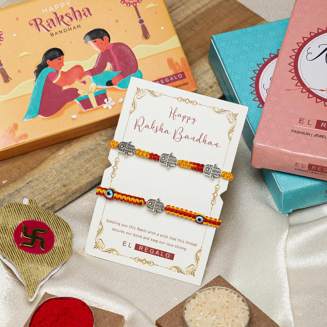 El Regalo 2 Hamsa Hand Evil Eye OM Rakhi Combo - Rakshabandhan Moli Charms Rakhi with Message Card & Roli Chawal Shagun in Rakhi Box for Bhaiya/Babhi/Bhatija/Bhatiji (Option-1)