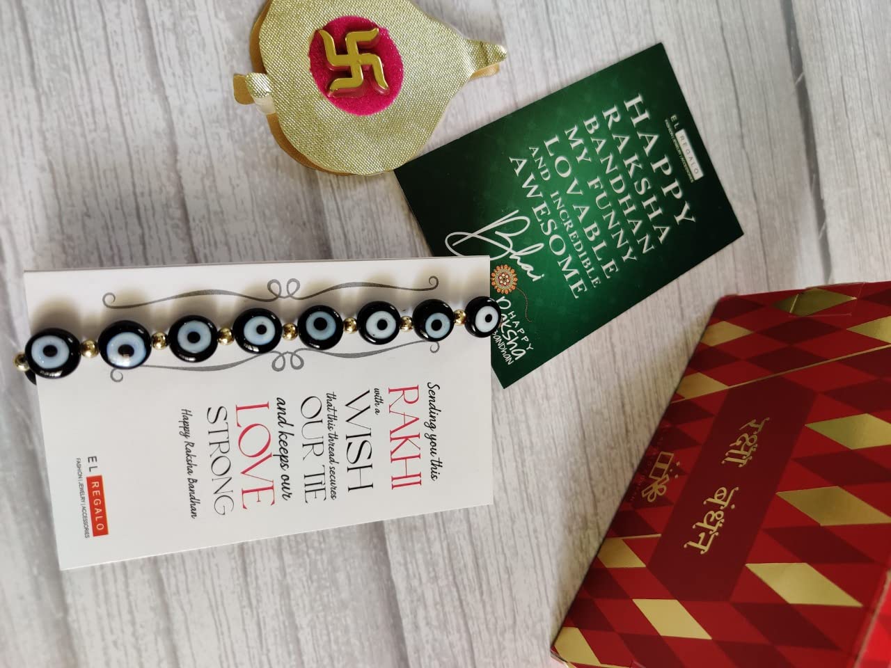 El Regalo Rakhi for Brother - Evil Eye Rakhi for Bhai/Bhabhi with, shagun & Message Card in Rakhi Gift Box (Black Evil Eye Rakhi)