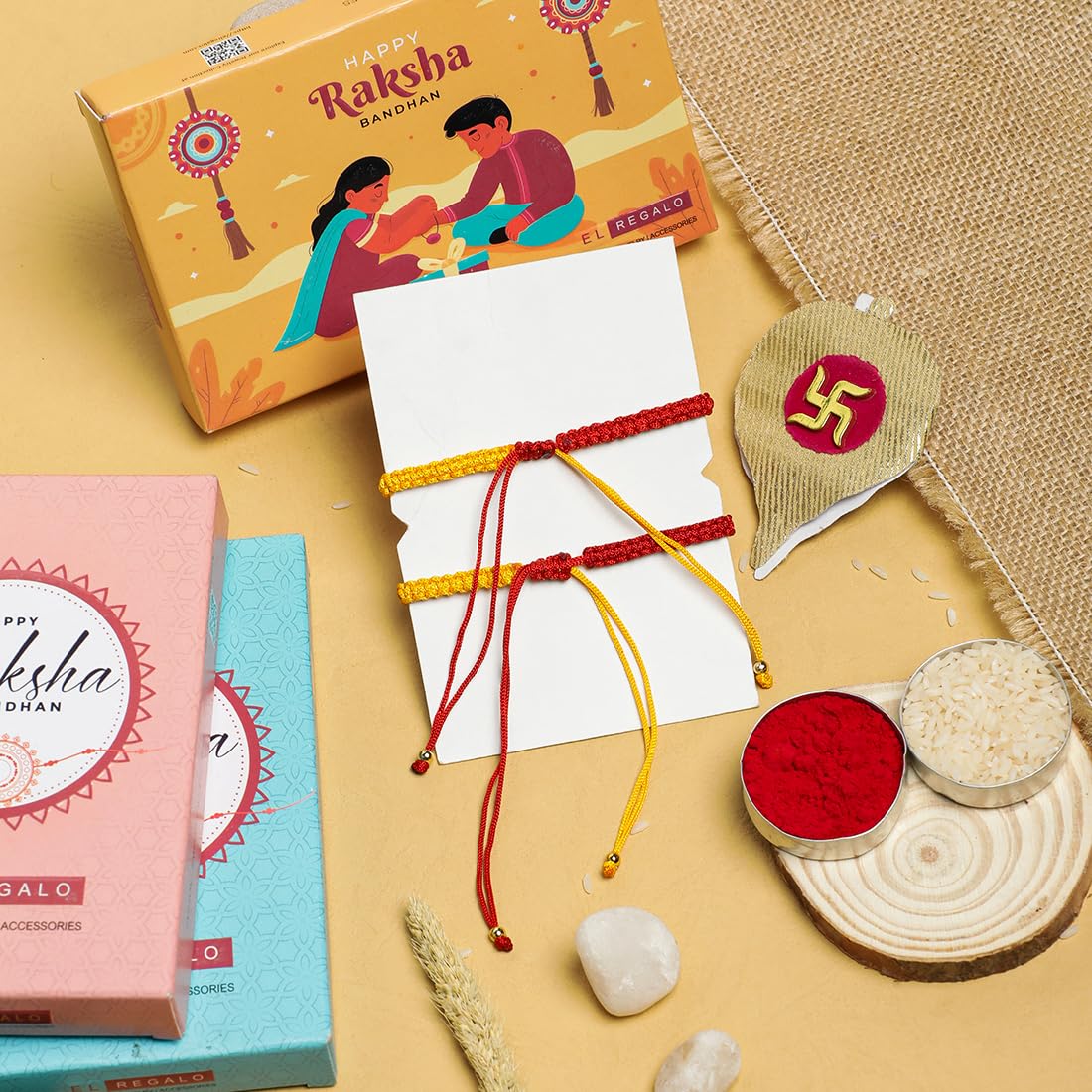El Regalo 1PC Auspicious Thread Rakhi Brother- Red & Yellow Thread OM, Ganesha, Shree, Trident, Damroo Mauli Rakhi with Roli Chawal Shagun, Message Card in Rakhi Gift Box (Shree Rakhi)