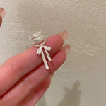 El Regalo Fashionable & Elegant Silver Matt Finish Ear Cuffs for Non Piercing Earrings- Ballet Hollow Cross Ribbon Ear Clips for Girls, Trendy Versatile Clip On Cuff Earrings for Girls & Women