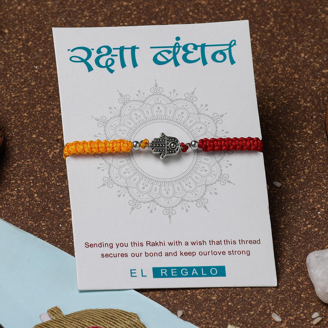 El Regalo 1 PC Designer Tassel Moli Rakhi, Hamsa Hand Moli Rakhi for Bhaiya - Rakshabandhan Red & Yellow Thread Rakhi with Message Card & Roli Chawal Shagun in Rakhi Box