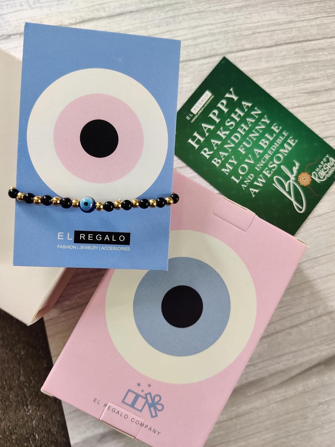 El Regalo Evil Eye Nazaria Rakhi for Babies/Toddler/Kids/Girls & Boys Evil Eye Adjustable Handwoven Nazaria Rakhi for Little Brother/Sister/Niece/Nephew (Evil Eye Nazaria with Tassel)