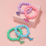 El Regalo 4PCs Cute Dinosaur Beaded Bracelet Set - Pastel Color Acrylic Dino Charm Bracelets for Girls & Kids