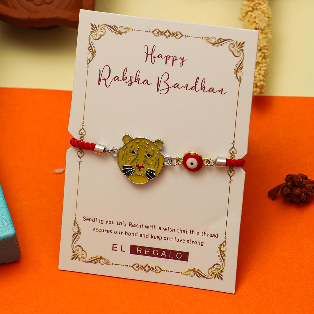 El Regalo Designer Evil Eye Lion Kids Rakhi for Brother- Cute Evil Eye Lion Rakhi with Roli Chawal Shagun, Rakhi Message Card in Rakhi Gift Box for Little Brother (Yellow)