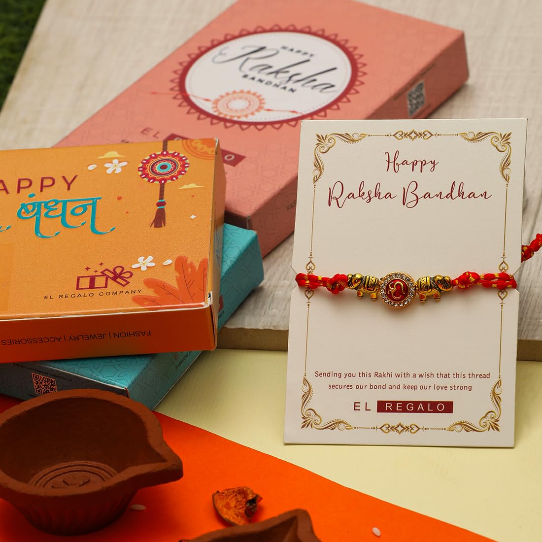 El Regalo 1PC Fancy OM Ganesha Swastik Red Moli Thread Rakhi for Brother/Bhai/Bhaiya- Auspicious OM/Aum, Ganesha, Satiya Rakhi with Roli Chawal, Rakhi Message Card in Rakhi Gift Box (OM Rakhi)