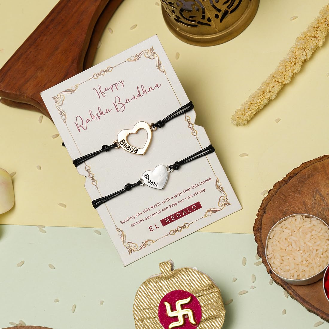 El Regalo 2PC Minimalist Matchin Hearts Bhaiya Bhabhi Rakhi Set- Bhaiya & Bhabhi Engraved Heart Rakhis with Roli-Chawal Shagun Pack, Rakhi Message Card in Rakhi Gift Box for Brother & Sister-in-law