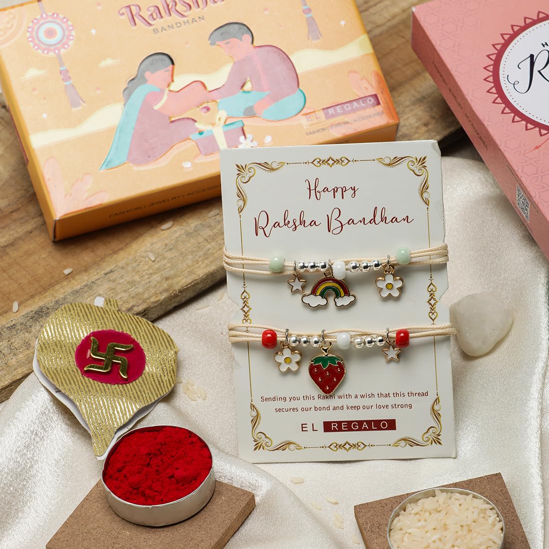 El Regalo 2 PCs Cute Kids Fancy Rakhis Combo Set - Beautiful 2 Kids Rakhis Set with Roli Chawal, Rakhi Message Card in Rakhi Gift Box for Little Brother/Niece/Nephew (Strawberry & Rainbow Rakhis)