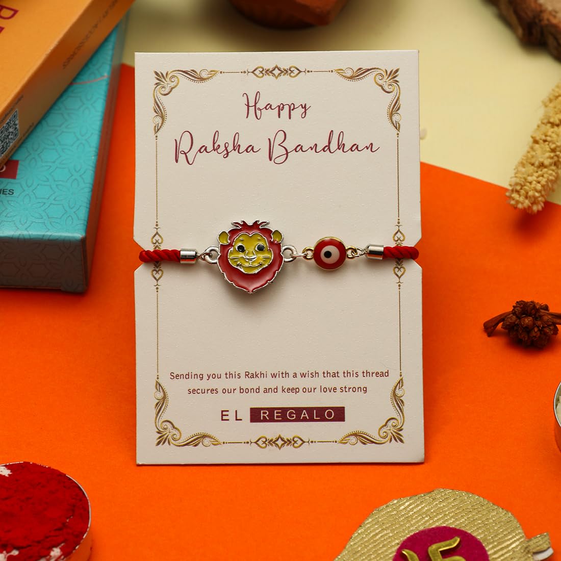 El Regalo Designer Evil Eye Lion Kids Rakhi for Brother- Cute Evil Eye Lion Rakhi with Roli Chawal Shagun, Rakhi Message Card in Rakhi Gift Box for Little Brother (Red)