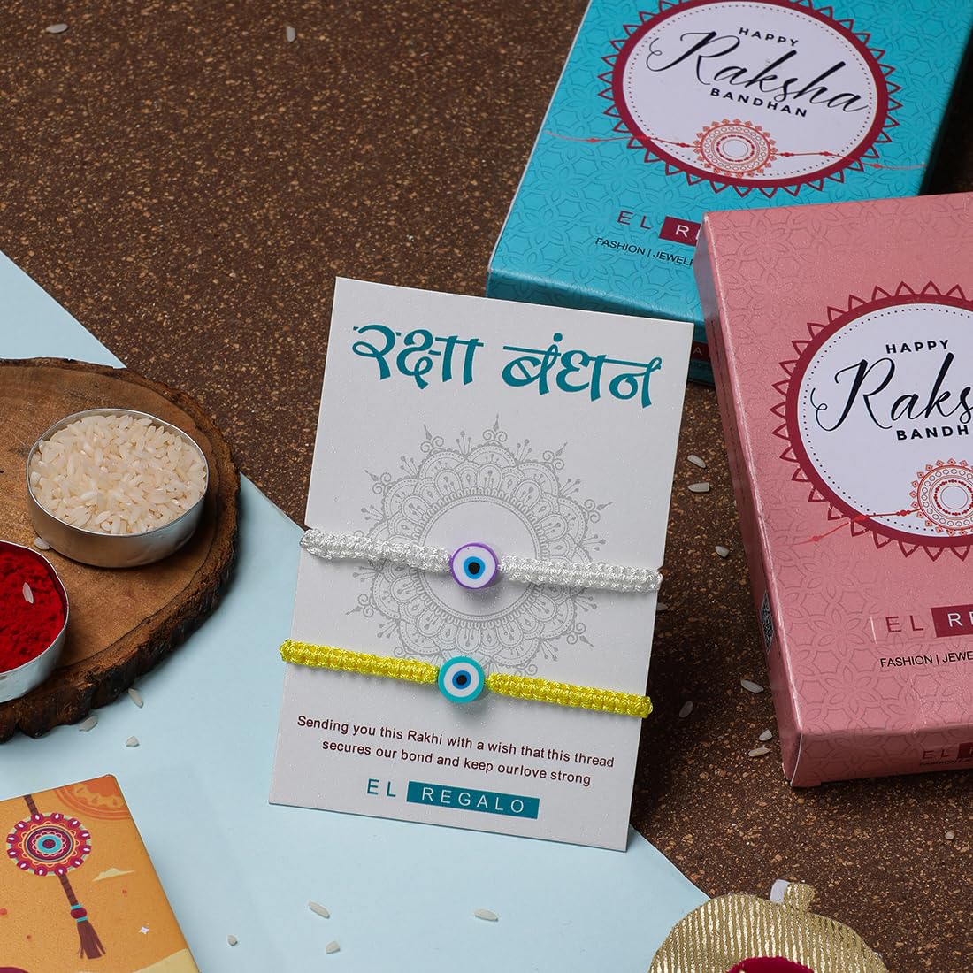 El Regalo 2PCs Rakhi Combo Set for Bhai-Bhabhi or Bhai-Bhatija/Bhatiji- 2 Evil Eye Rakhis Set with Roli Chanwal, Rakhi Card in Rakhi Gift Box (Option-2)