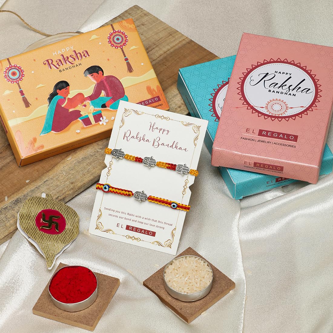El Regalo 2 Hamsa Hand Evil Eye OM Rakhi Combo - Rakshabandhan Moli Charms Rakhi with Message Card & Roli Chawal Shagun in Rakhi Box for Bhaiya/Babhi/Bhatija/Bhatiji (Option-1)