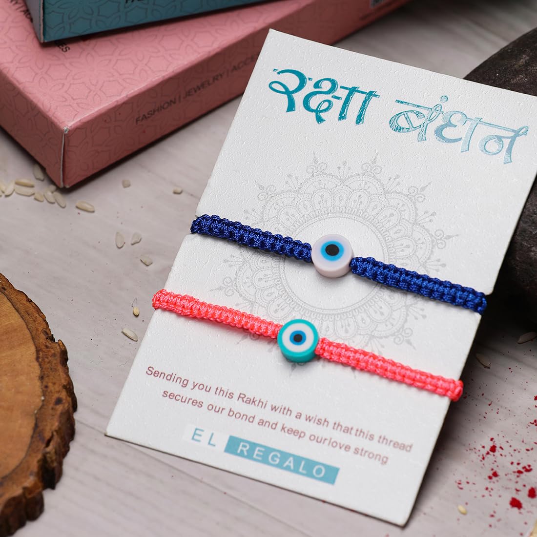 El Regalo 2PCs Rakhi Combo Set for Bhai-Bhabhi or Bhai-Bhatija/Bhatiji- 2 Evil Eye Rakhis Set with Roli Chanwal, Rakhi Card in Rakhi Gift Box (Option-5)