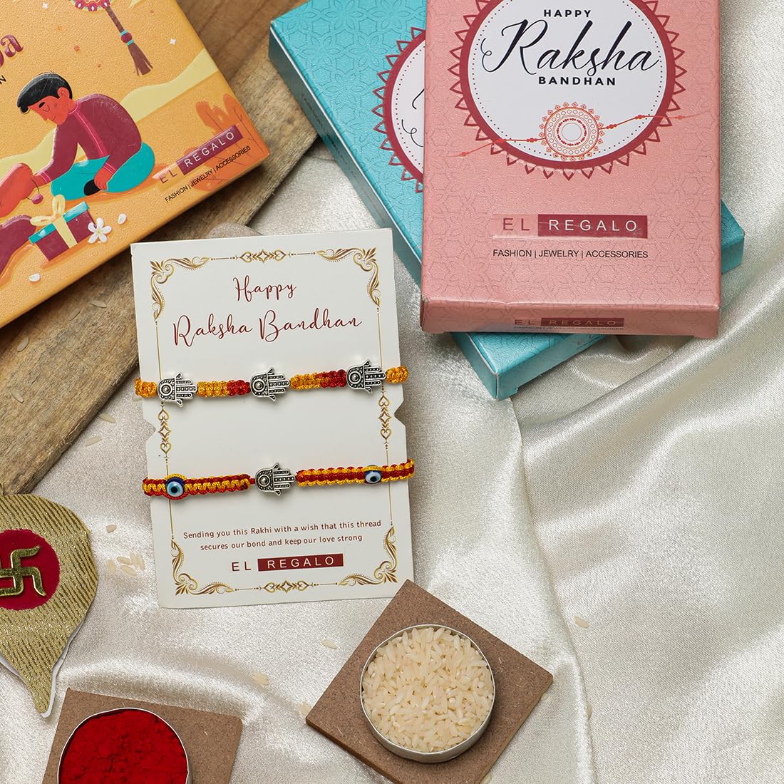 El Regalo 2 Hamsa Hand Evil Eye OM Rakhi Combo - Rakshabandhan Moli Charms Rakhi with Message Card & Roli Chawal Shagun in Rakhi Box for Bhaiya/Babhi/Bhatija/Bhatiji (Option-1)