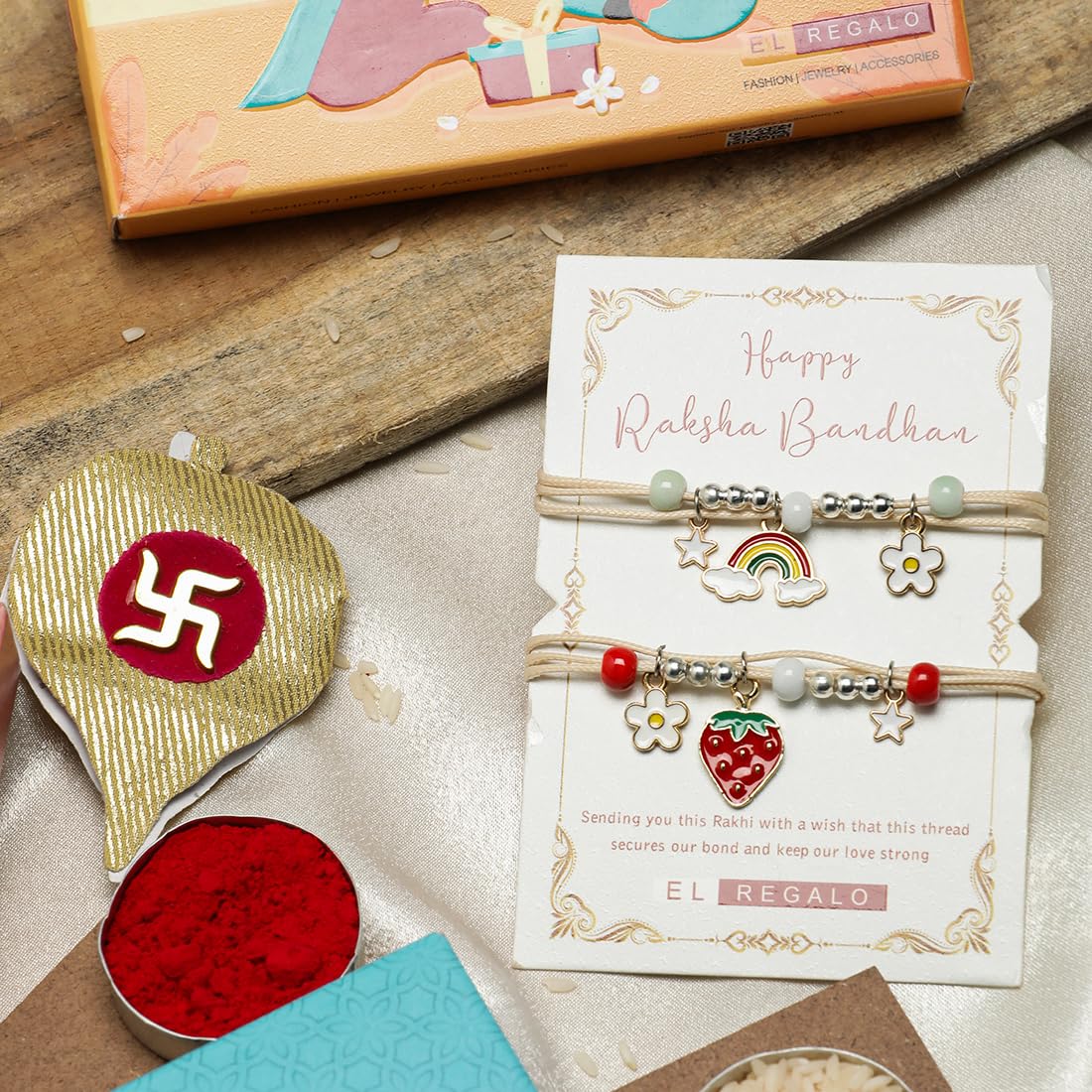 El Regalo 2 PCs Cute Kids Fancy Rakhis Combo Set - Beautiful 2 Kids Rakhis Set with Roli Chawal, Rakhi Message Card in Rakhi Gift Box for Little Brother/Niece/Nephew (Strawberry & Rainbow Rakhis)